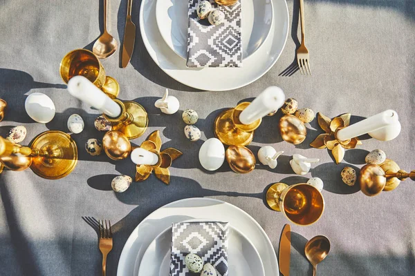 Top view of easter decorated table with golden eggs — Stock Photo