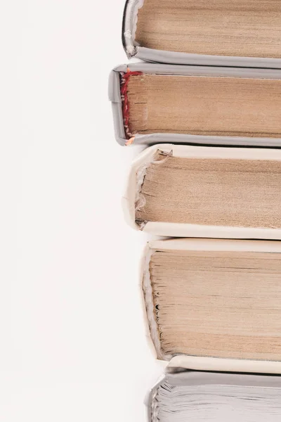 Cropped image of stack of books isolated on white — Stock Photo