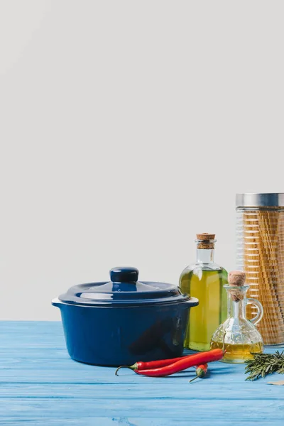 Pan and ingredients for cooking pasta on table in kitchen — Stock Photo