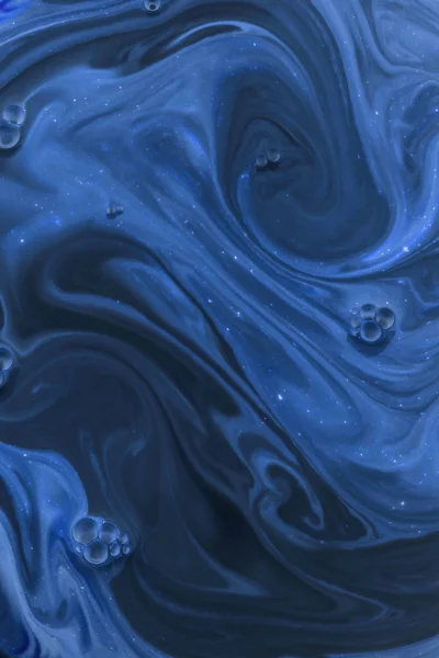 Abstract dark texture with blue paint — Stock Photo