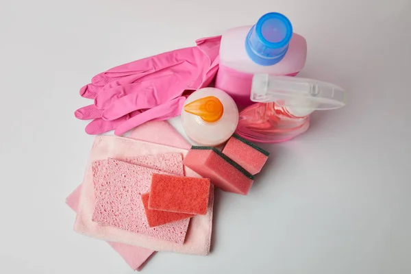 High angle view of domestic supplies for spring cleaning on white surface — Stock Photo