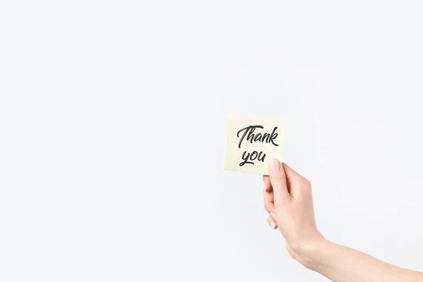 Partial view of woman holding thank you card isolated on white — Stock Photo