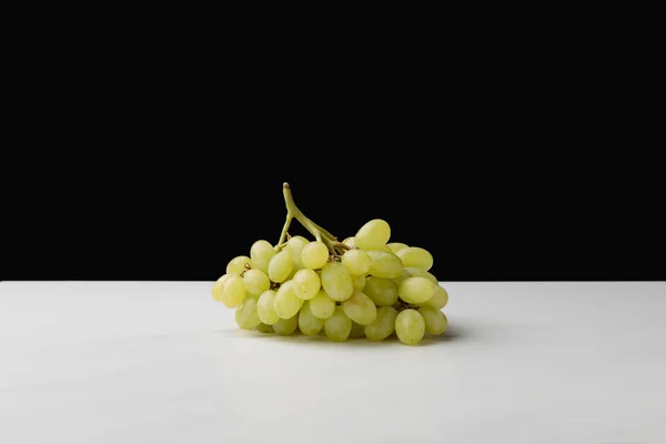 Close up view of pile of white grapes on black — Stock Photo