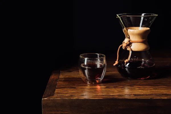 Alternative coffee in chemex and glass mug on wooden table — Stock Photo