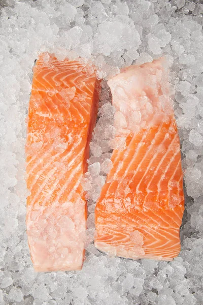 Close-up shot of slices of salmon on crushed ice — Stock Photo