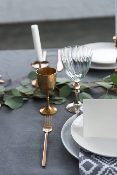 Close up view of empty card on plates on tabletop with beautiful rustic setting for guests — Stock Photo