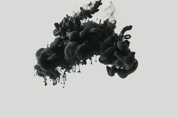 Close up view of black ink in water isolated on gray — Stock Photo