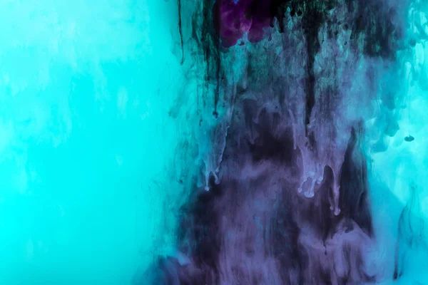 Creative texture with turquoise and purple splashes of paint — Stock Photo