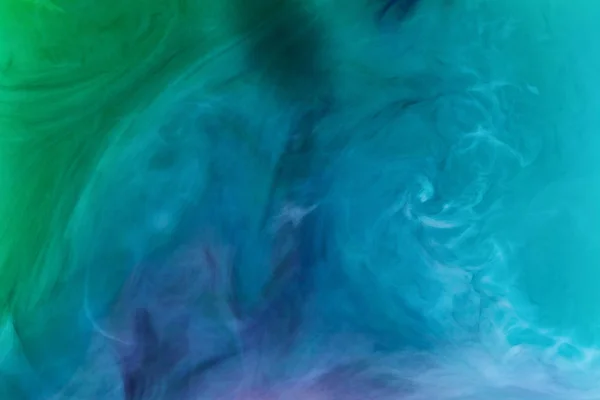 Creative texture with blue and green flowing paint — Stock Photo