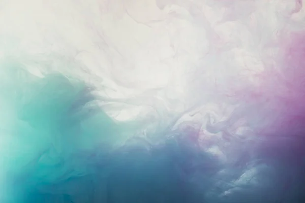 Abstract light background with flowing blue and purple watercolor paint — Stock Photo