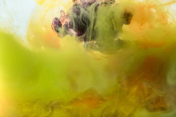 Artistic background with flowing yellow, orange and purple paint — Stock Photo