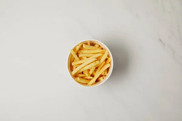 Top view of bowl of french fries on white — Stock Photo