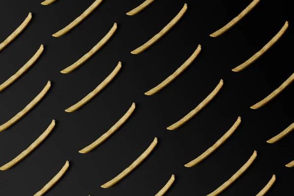 Top view of french fries pattern isolated on black — Stock Photo