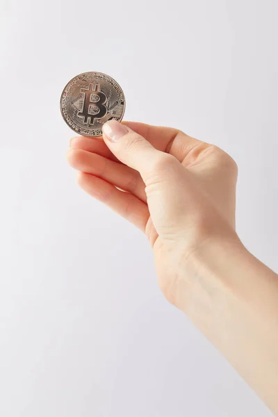 Cropped shot of woman holding silver bitcoin isolated on white — Stock Photo