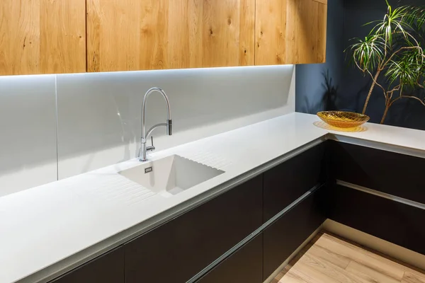 Renovated kitchen interior with white sink — Stock Photo