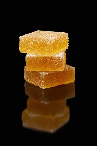 Closeup view of stack of jelly candies on black background — Stock Photo