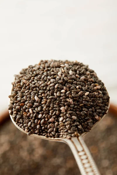 Selective focus of chia seeds in spoon — Stock Photo