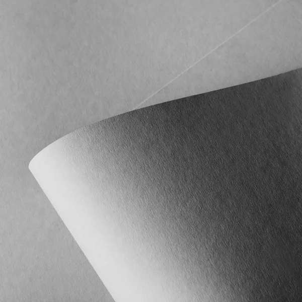 Close-up view of grey rolled paper sheet background — Stock Photo