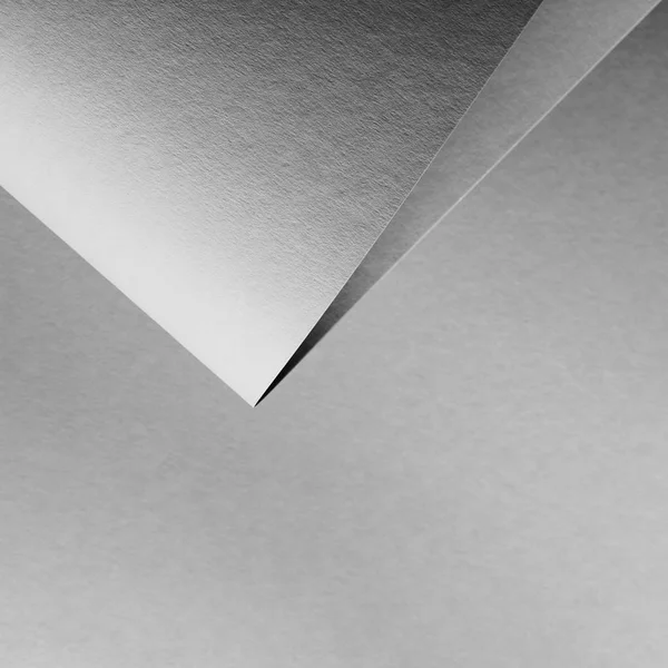 Vista de primer plano del fondo de papel laminado vacío gris - foto de stock