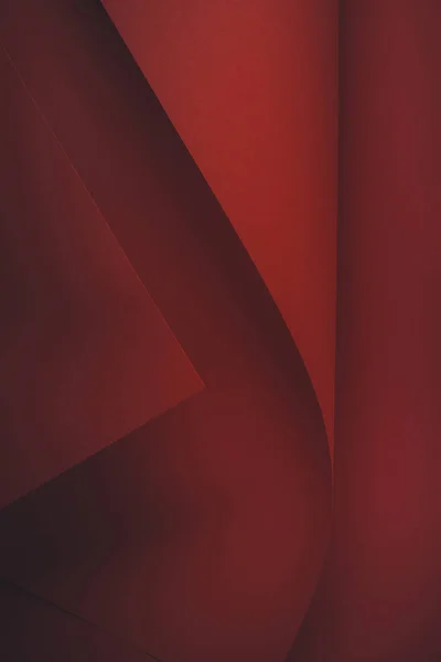 Vista de primer plano del fondo de papel abstracto rojo oscuro - foto de stock