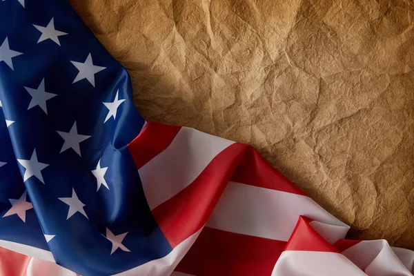 Top view of american flag and vintage crumpled paper — Stock Photo