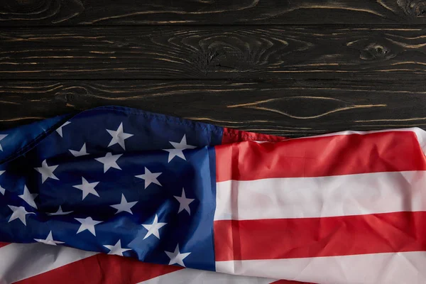 Top view of united states flag on wooden surface — Stock Photo