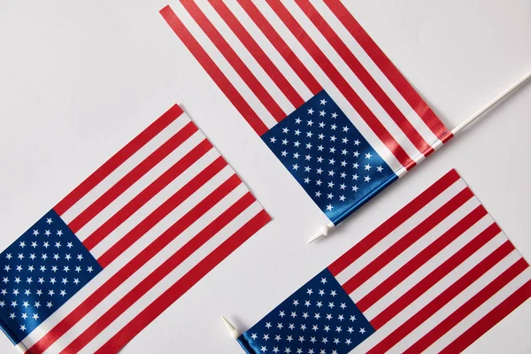 Top view of united states of america flagpoles on white surface — Stock Photo