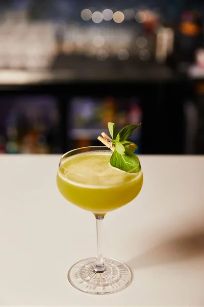 Fresh alcohol cocktail in glass on bar counter — Stock Photo