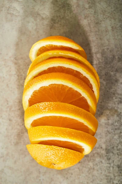 Top view of sliced and ripe orange on marble surface — Stock Photo