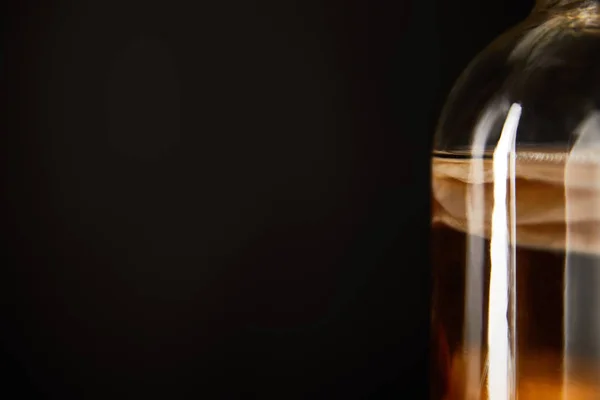 Close up view of glass jar with kombucha isolated on black — Stock Photo