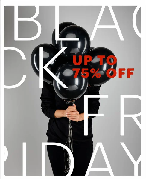 Woman with obscure face holding bunch of black balloons isolated on grey with black Friday, up to 75 percent off illustration — Stock Photo