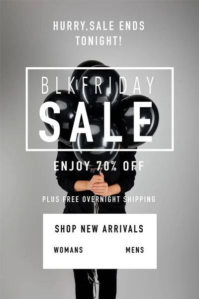 Woman with obscure face holding bunch of black balloons isolated on grey with black Friday illustration — Stock Photo