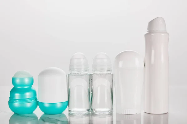 Bottles of deodorant isolated on white — Stock Photo