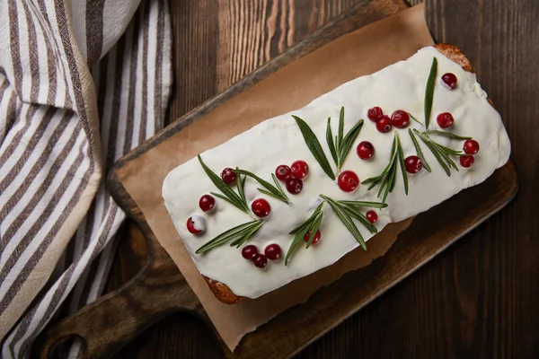 Top view of traditional Christmas cake with cranberry on wooden table — Stock Photo