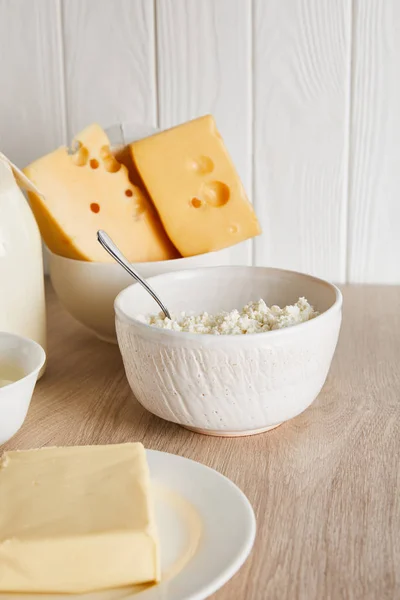 Delicious fresh dairy products on white wooden background — Stock Photo