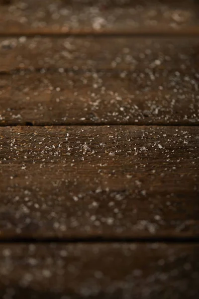 Christmas background of wooden surface with snow — Stock Photo