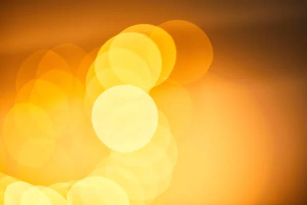 Festive blurred background, bokeh of yellow christmas lights — Stock Photo