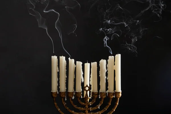 Candles with smoke in menorah on Hanukkah on black — Stock Photo