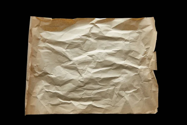 Vista superior de papel vintage arrugado vacío aislado en negro - foto de stock