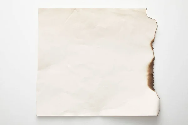 Top view of empty burnt vintage paper on white background — Stock Photo