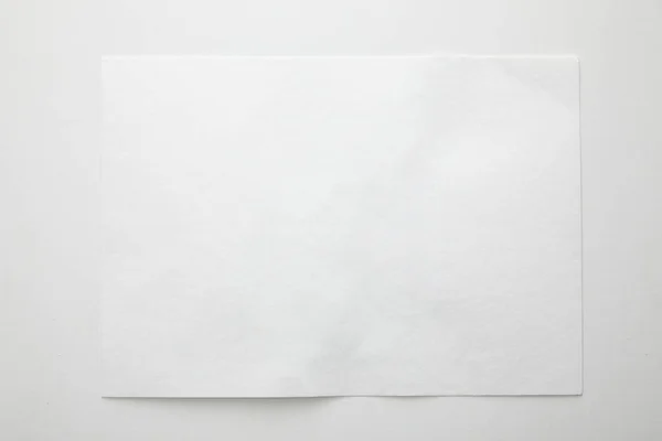 Top view of empty paper on white background — Stock Photo