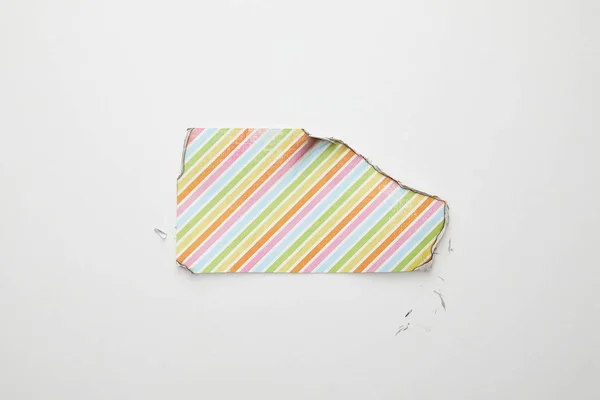 Top view of empty burnt paper with colorful lines on white background — Stock Photo