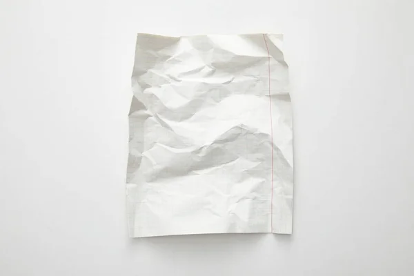 Vista superior de papel enrugado vazio sobre fundo branco — Fotografia de Stock