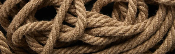 Top view of rope on black background, panoramic shot — Stock Photo