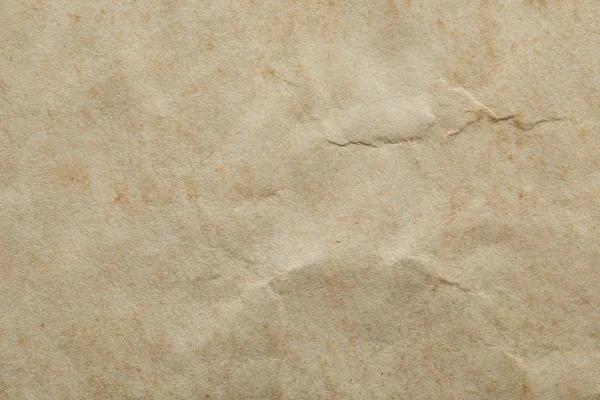 Top view of crumpled vintage beige paper texture with copy space — Stock Photo