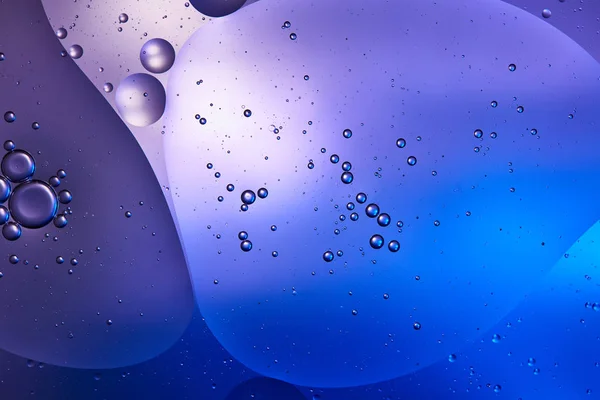 Blue and purple color abstract background from mixed water and oil — Stock Photo