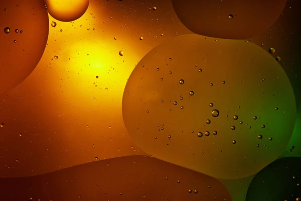 Beautiful orange color abstract background from mixed water and oil — Stock Photo