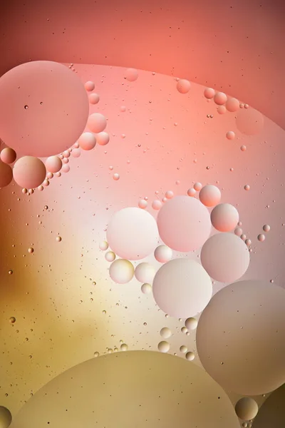Creative background from mixed water and oil bubbles in red and yellow color — Stock Photo