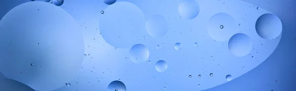 Panoramic shot of Beautiful color abstract background from mixed water and oil in blue color — Stock Photo