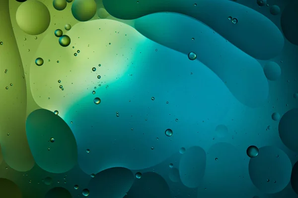 Creative abstract background from mixed water and oil in blue and green color — Stock Photo